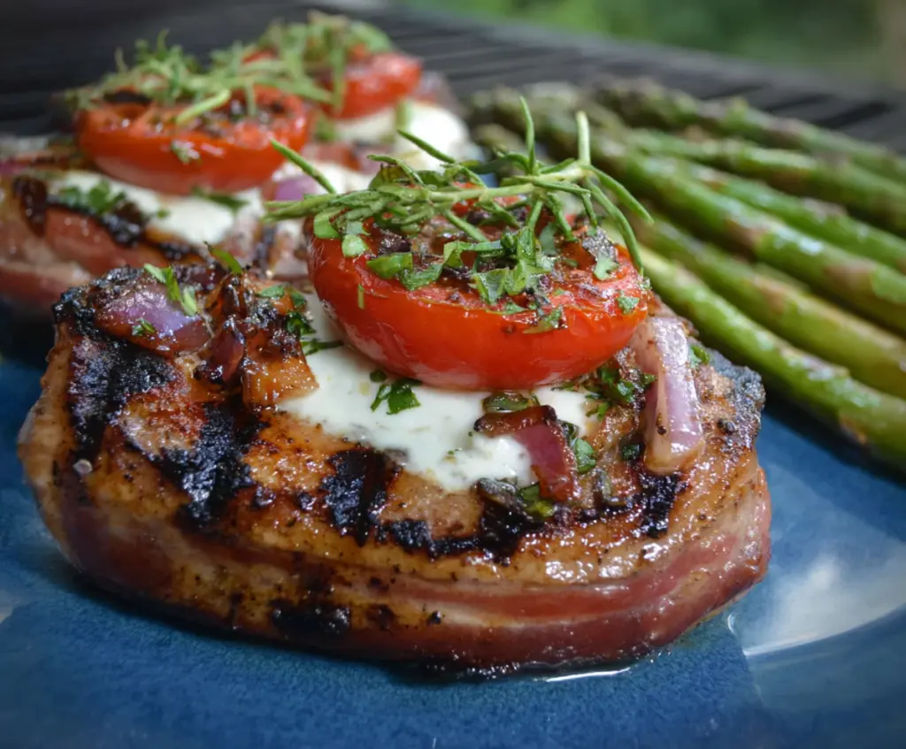 Juicy grilled Italian pork chops seasoned with herbs and served with fresh vegetables.