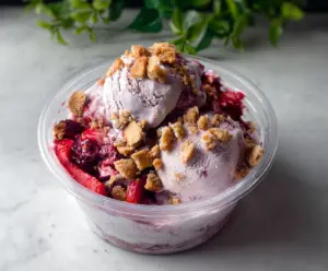 Delicious Berry Crumble Ice Cream with fresh mixed berries and crunchy crumble topping